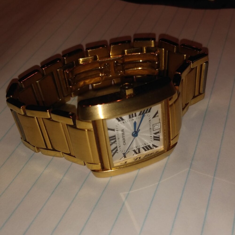 Men's gold Cartier tank watch